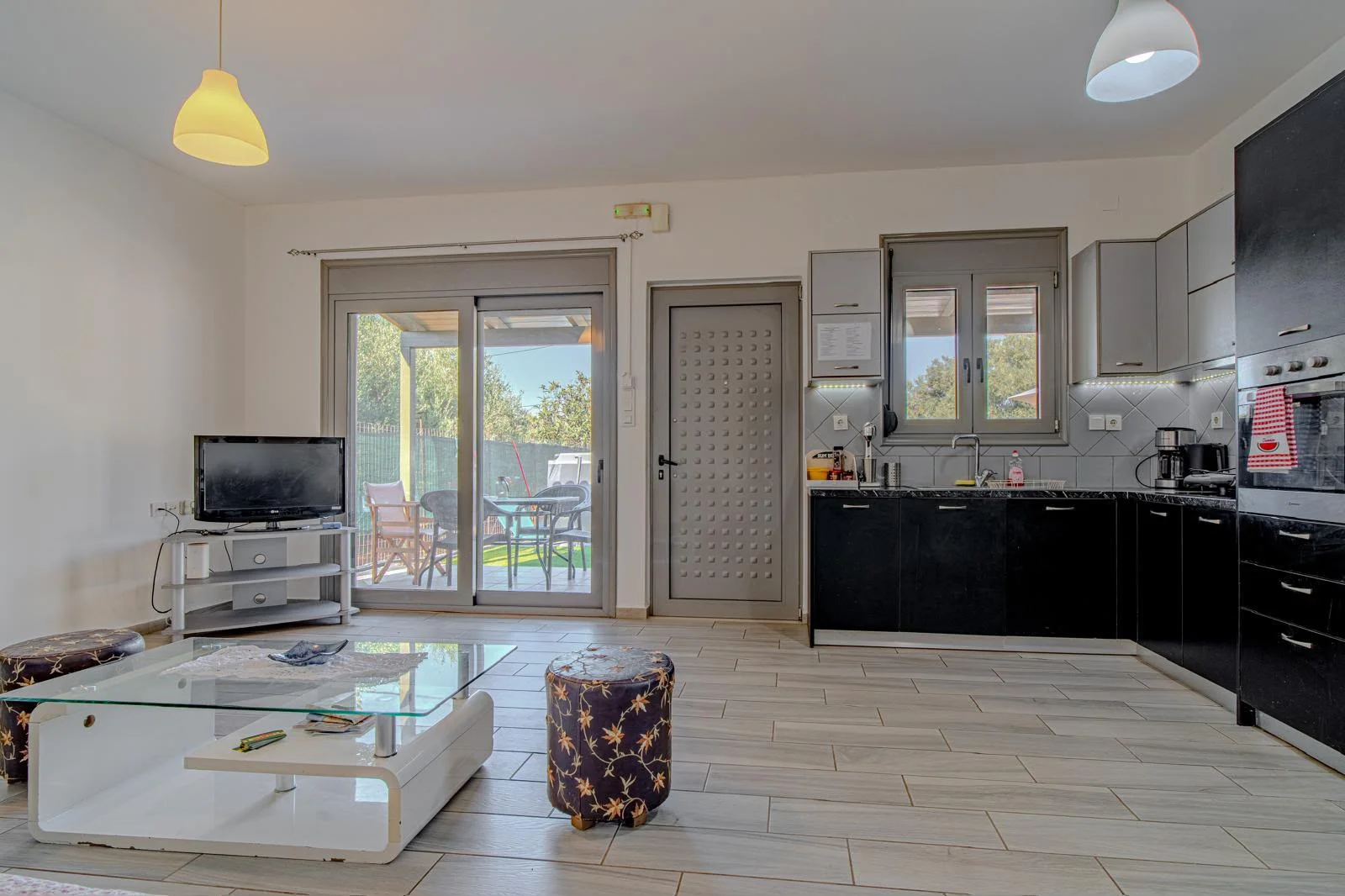 hania-tsikalaria-2-bedroom-house-for-sale (8) Modern 2-Bedroom Private Residence with Pool in Souda, Chania - Kitchen- Living Room Area